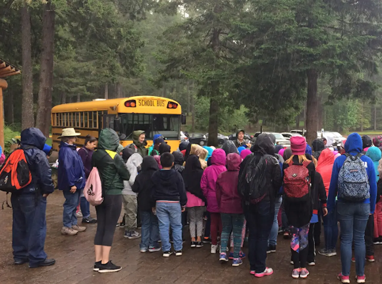 Students gathering for a rainy day field trip at Silver Falls State Park in Oregon