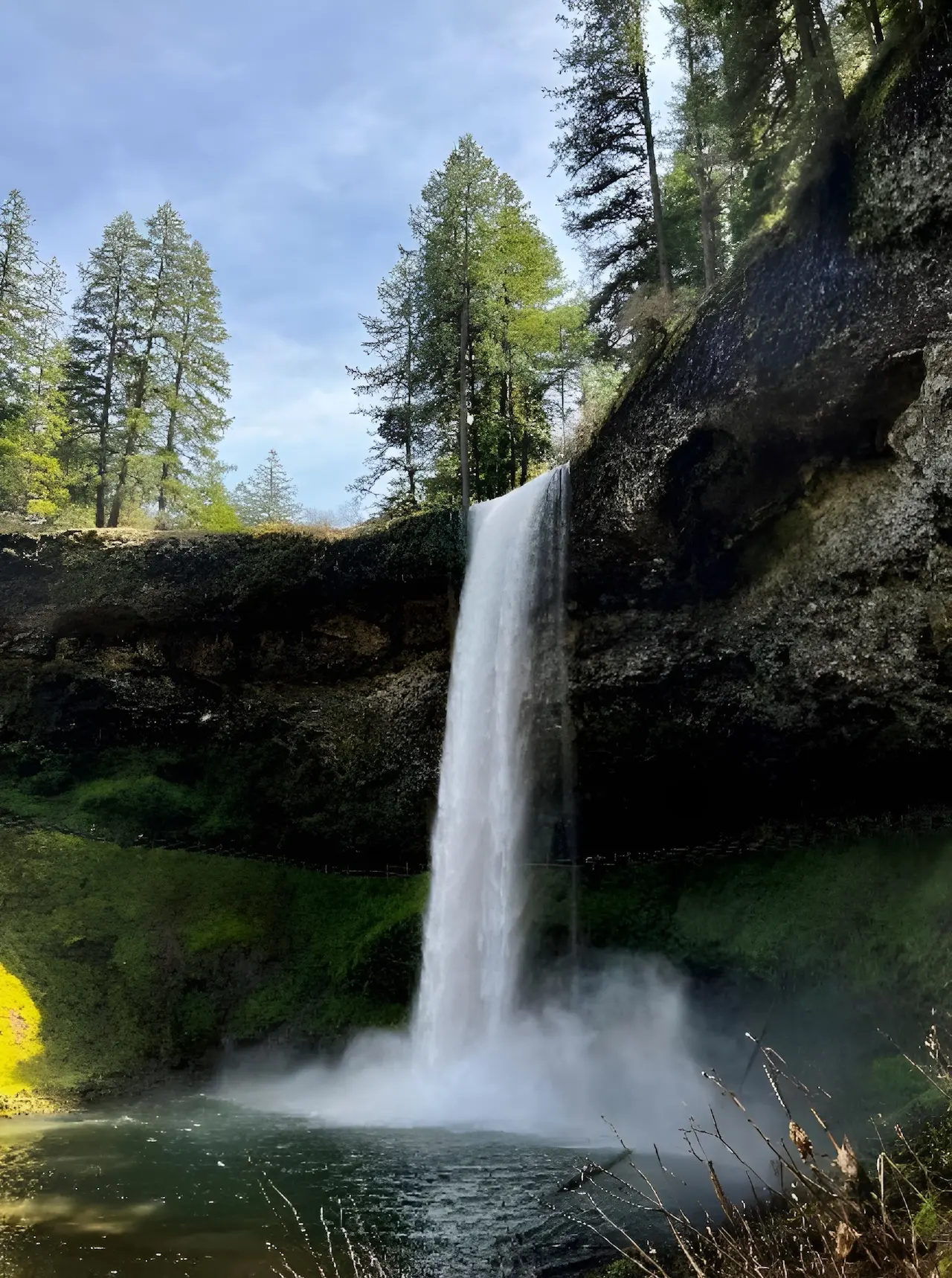 South Falls waterfall cascading into lush canyon basin