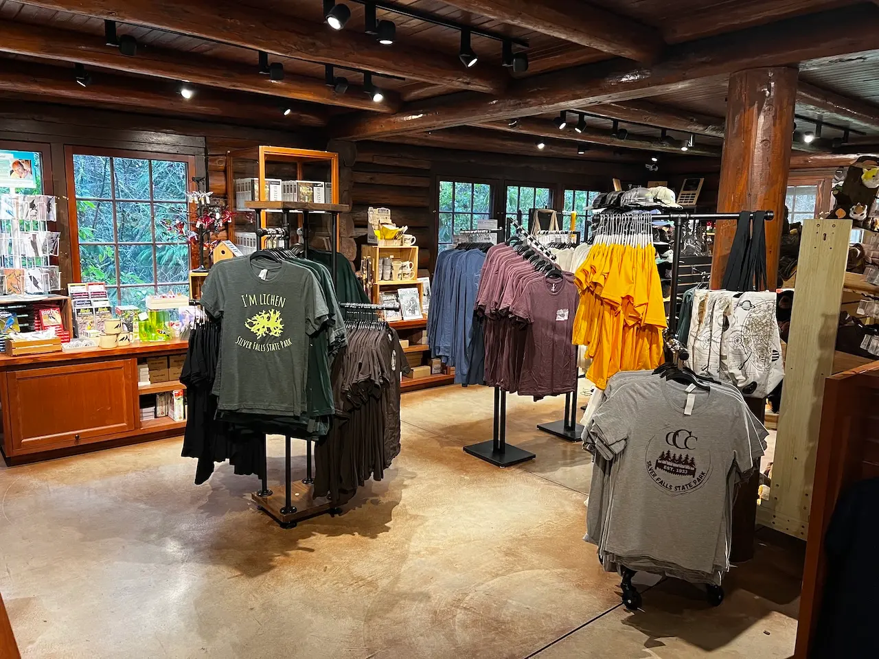 nature store Rustic park gift shop interior with outdoor apparel, souvenirs, and nature-themed merchandise displays