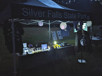 Friends of Silver Falls Administrator Chelsea Sims provided relevant Nature Store items available for purchase.